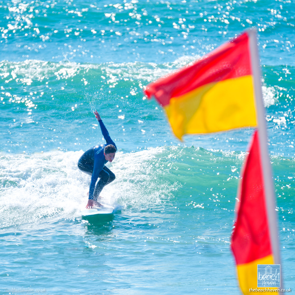 Surfer and flags